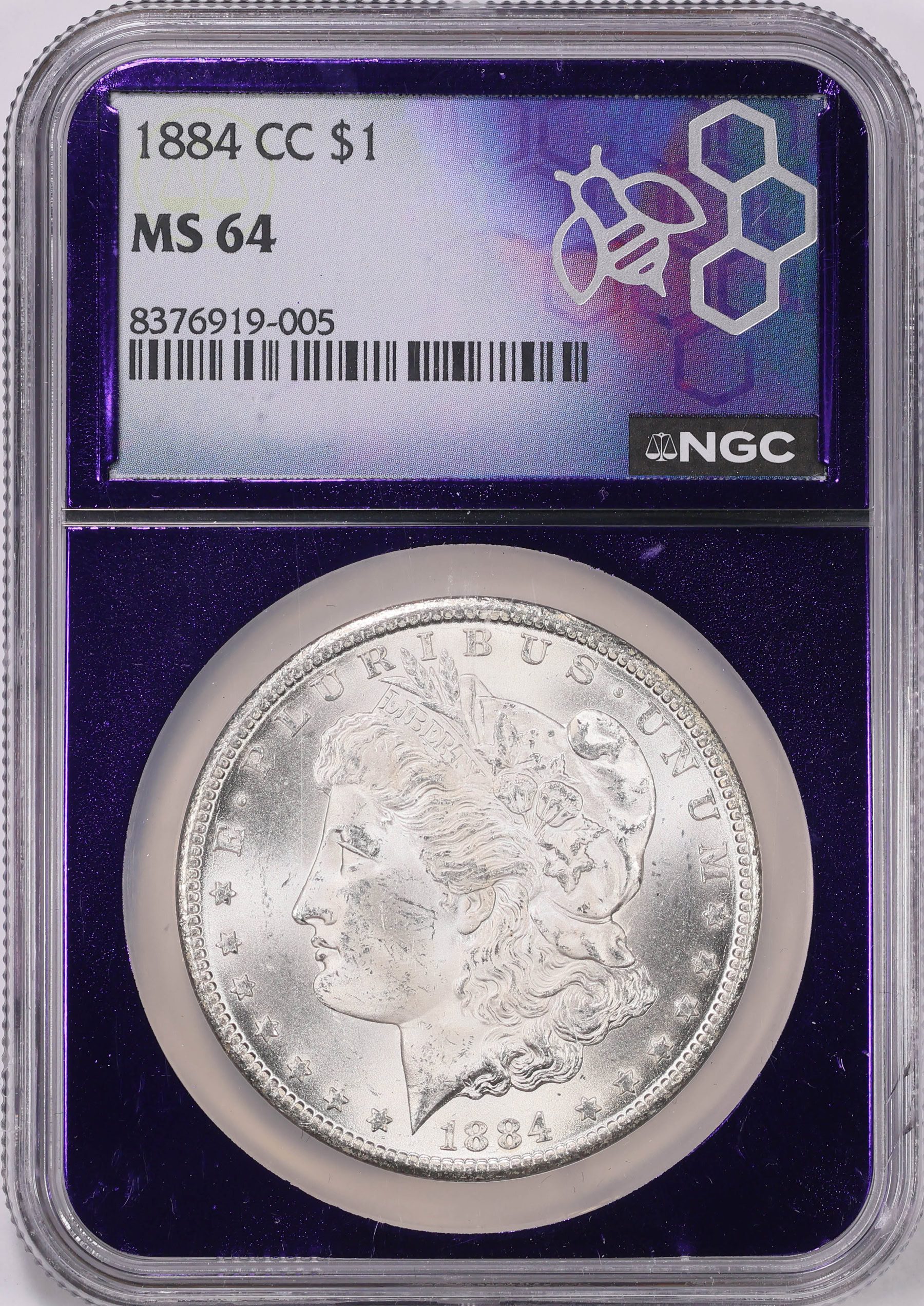 1884-CC Morgan Silver Dollar NGC MS-64 (Purple Bee Frame Holder