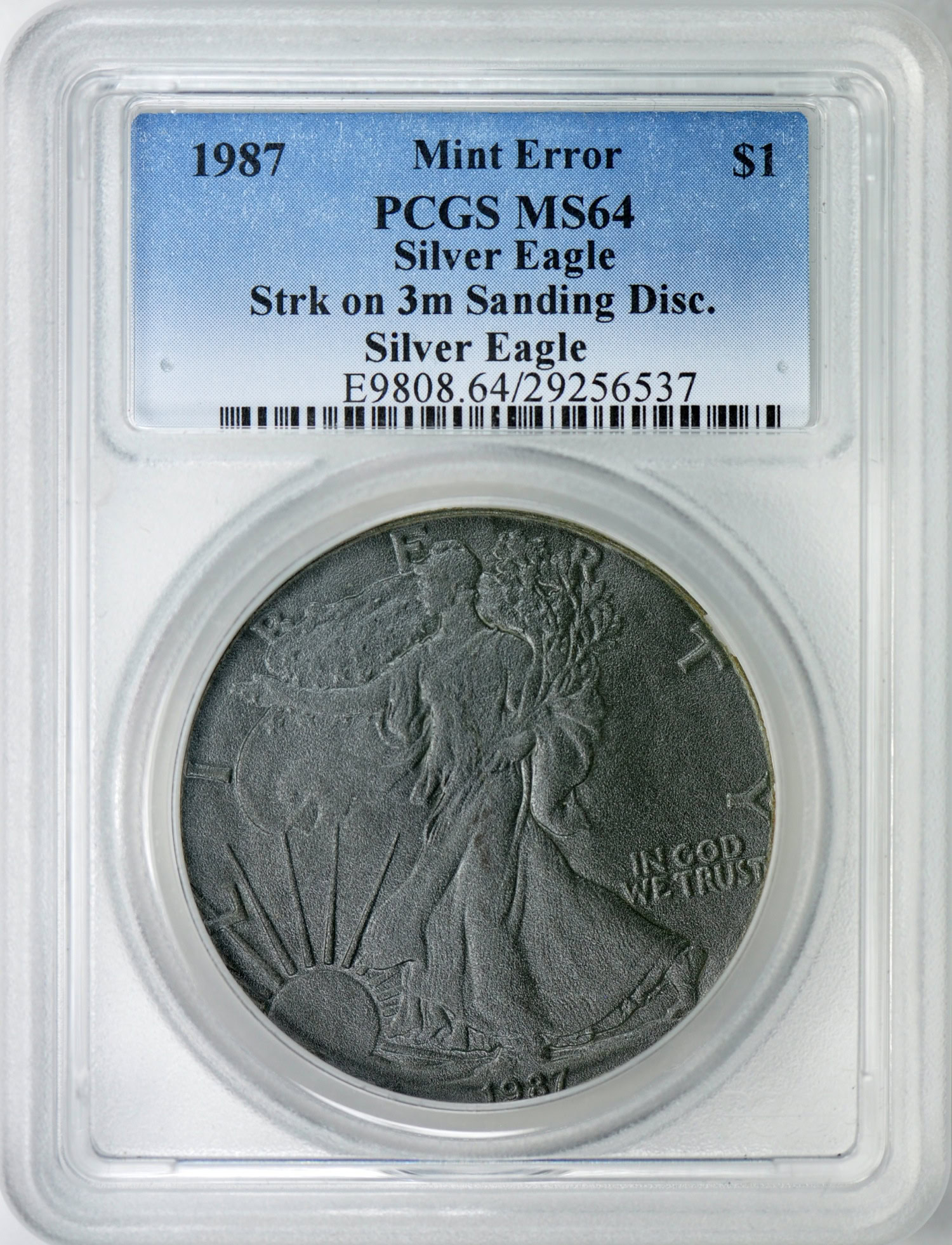 Mint Error 1987 $1 Silver Eagle Struck on 3m Sanding Disc. PCGS MS